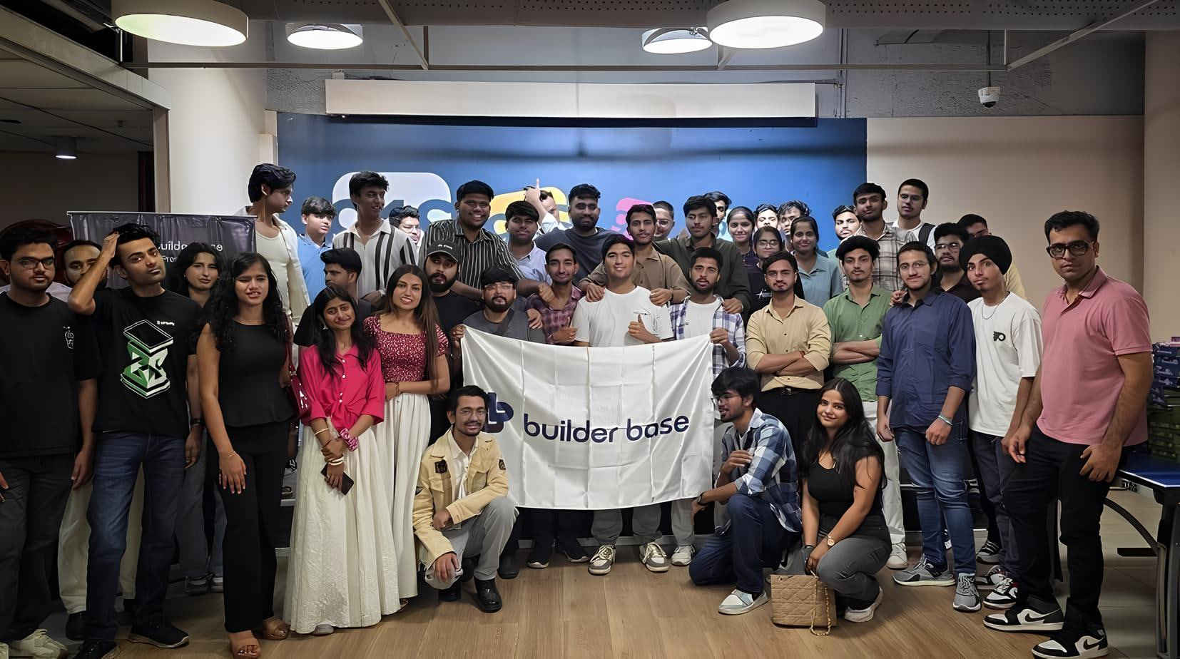 Builders gathered together behind the Builder Base banner after an activation.